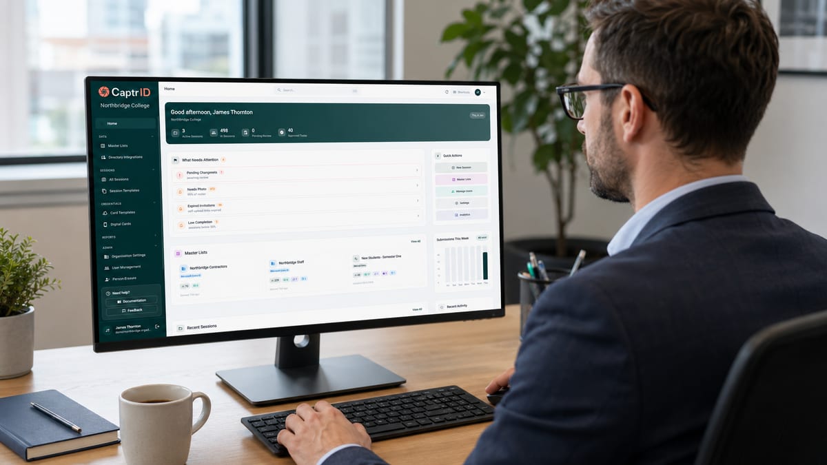 A manager reviewing staff IDs in the CaptrID admin dashboard on a desktop monitor
